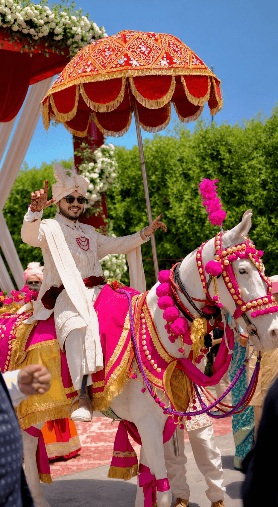 Groom arriving on a flower-decorated horse
